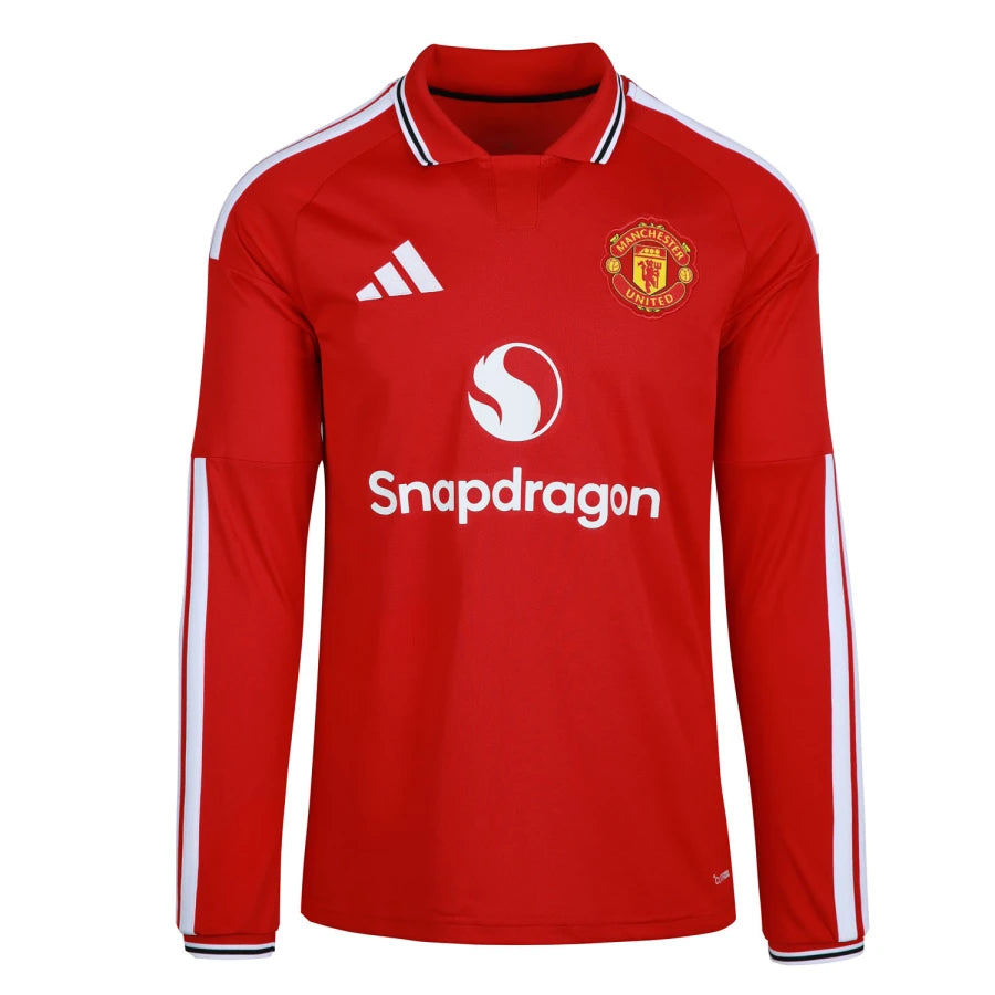 A red long-sleeve Manchester United soccer jersey by Adidas, featuring white stripes on the shoulders and sleeves, the Manchester United crest on the chest, and the Snapdragon sponsor logo in white.