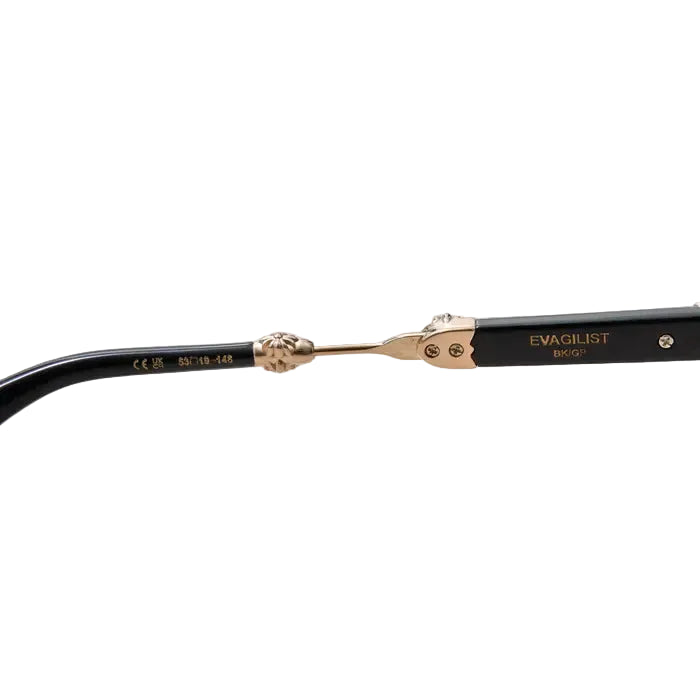 Close-up of the hinge and inner temple arms of a pair of black sunglasses with ornate gold-tone detailing, including the brand name EVAGUILIST and model BRID.