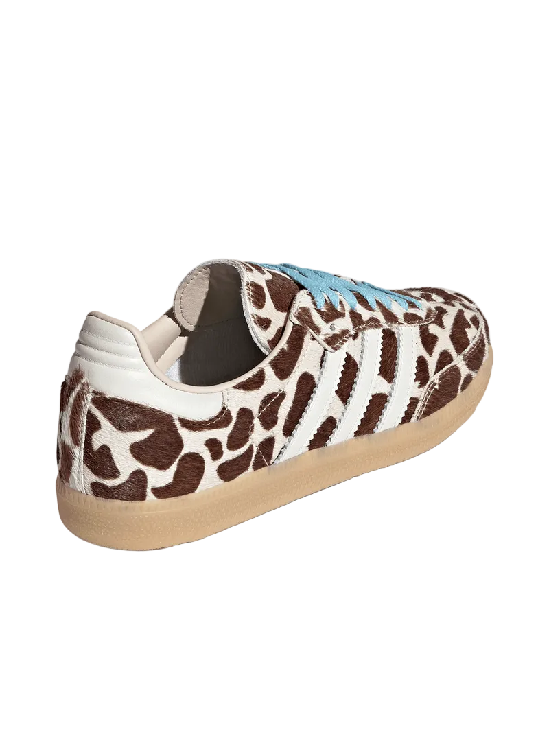 Sneaker with a giraffe pattern on a light gray background