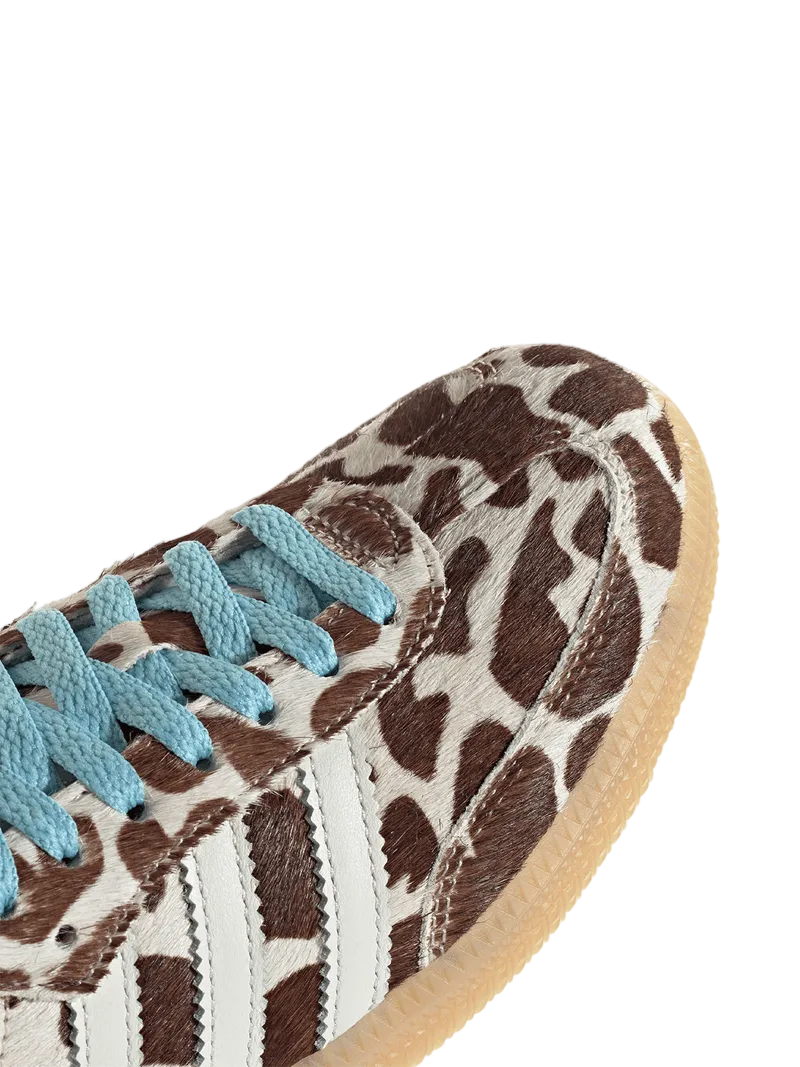 Close-up of a sneaker with a giraffe pattern on a white background