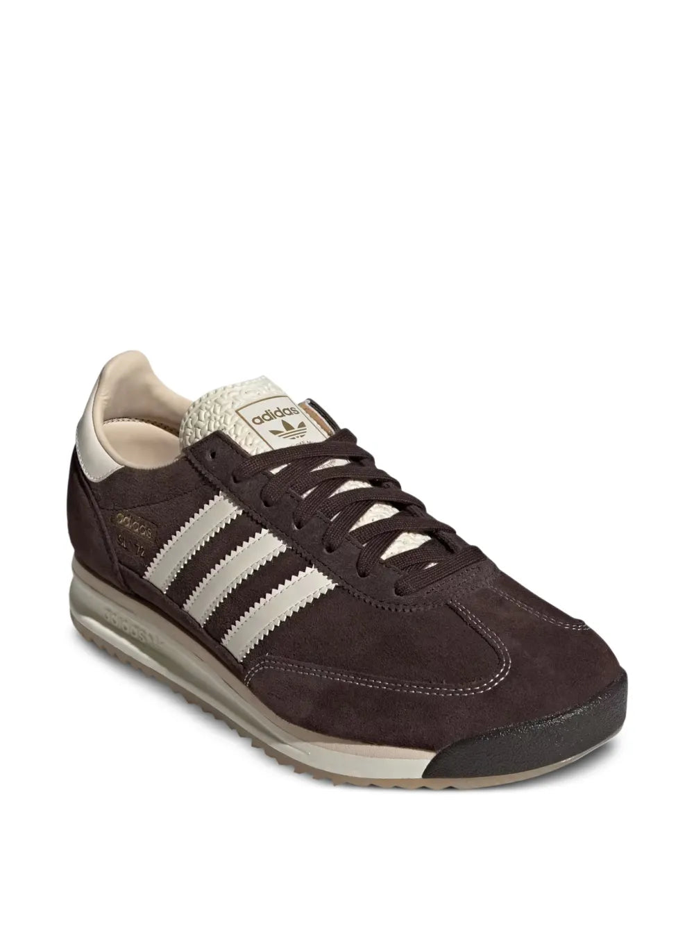 A single Adidas sneaker in dark brown suede with three cream stripes, a cream collar lining, and a cream midsole, shown on a plain white background.