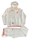 A white zip-up hoodie and matching sweatpants set laid flat on a dark gray textured background. The tracksuit features bright orange drawstrings, trim, and logo details, along with a small embroidered horse logo on the chest.