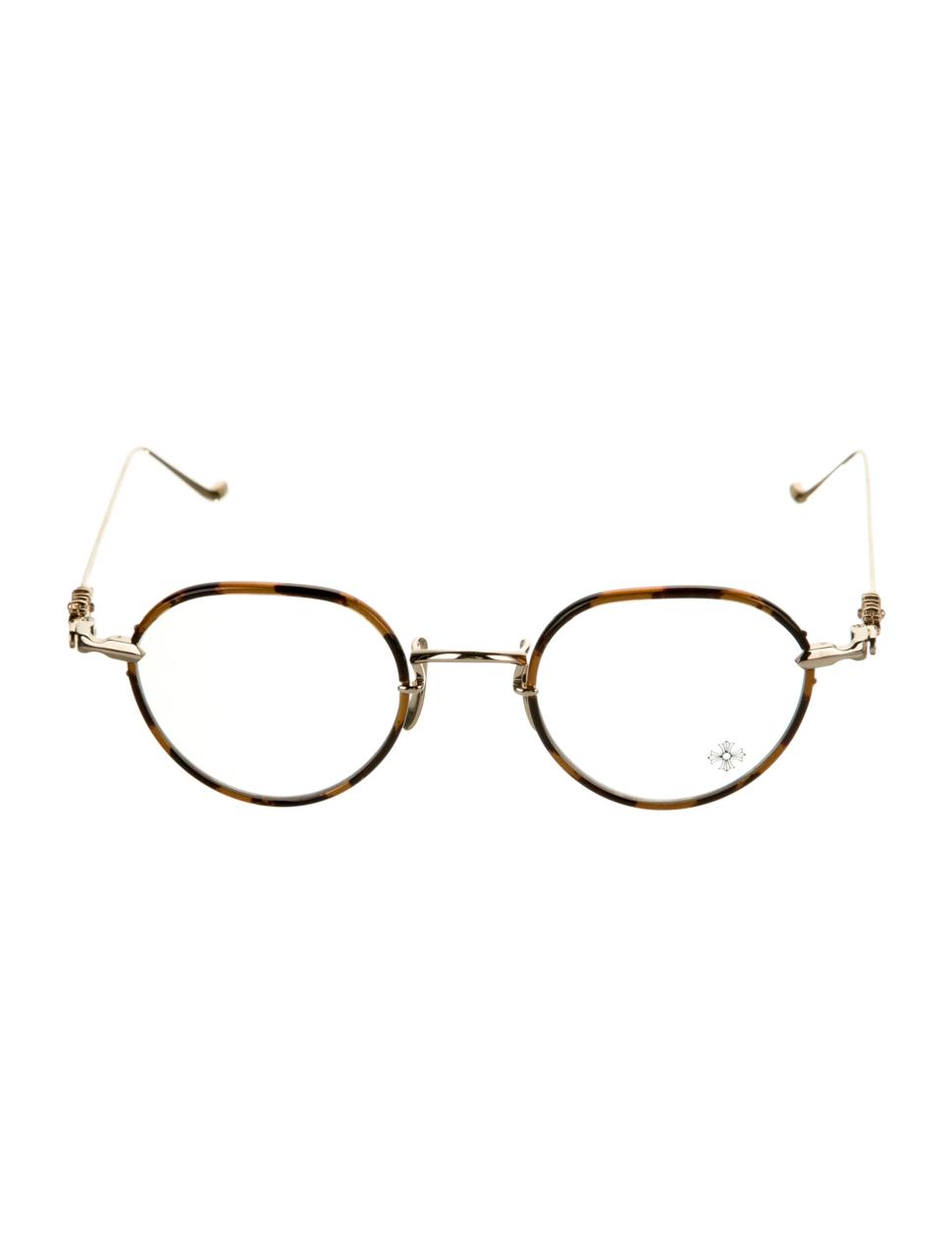 Oval eyeglasses with thin gold-tone metal frames, brown tortoiseshell rims, and matching temple arms, shown against a plain white background.