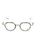 Oval eyeglasses with thin gold-tone metal frames, brown tortoiseshell rims, and matching temple arms, shown against a plain white background.