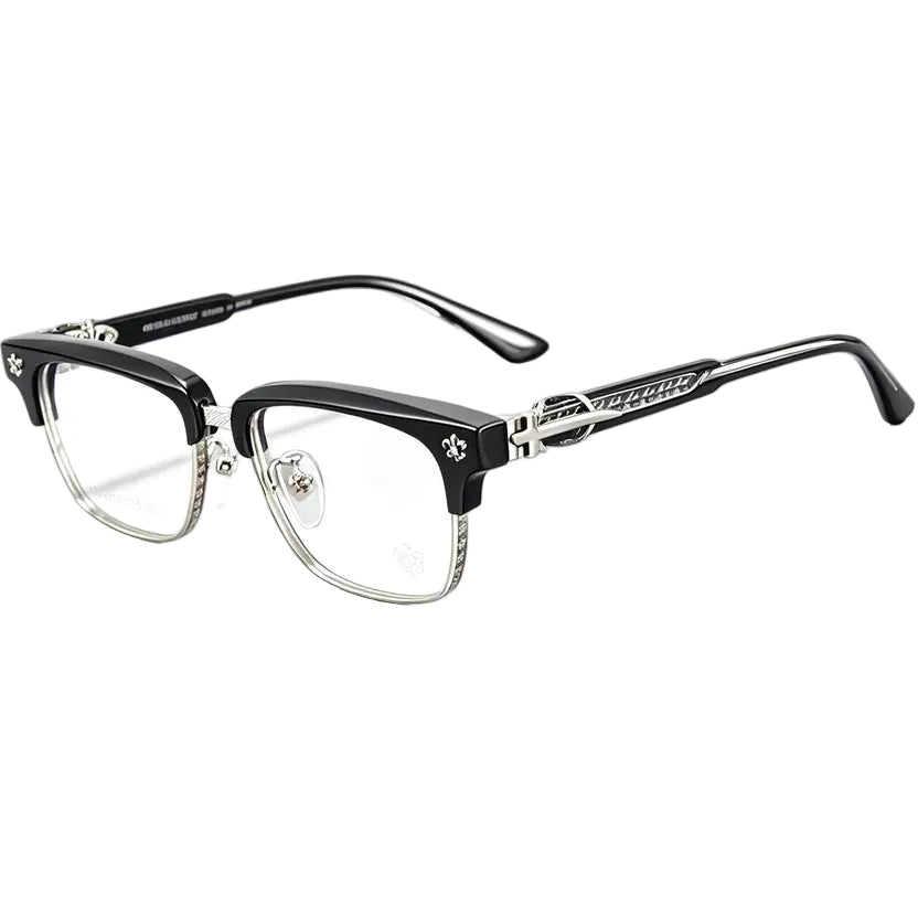 A pair of semi-rimless eyeglasses with a glossy black acetate upper frame and clear lower rims, featuring silver metal temples with decorative skull and crossbones details and the brand name 'Mister Loco' visible.