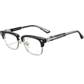 A pair of semi-rimless eyeglasses with a glossy black acetate upper frame and clear lower rims, featuring silver metal temples with decorative skull and crossbones details and the brand name 'Mister Loco' visible.