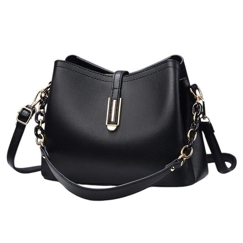 South Steeze black shell-shaped crossbody bag in durable PU leather with gold hardware and adjustable shoulder strap