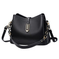 South Steeze black shell-shaped crossbody bag in durable PU leather with gold hardware and adjustable shoulder strap