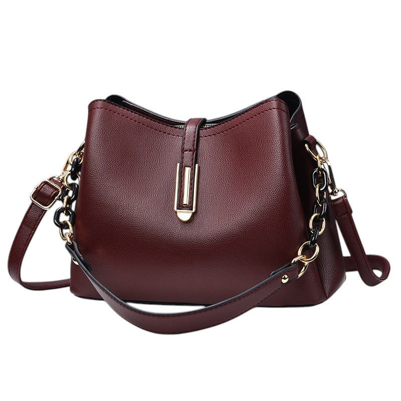 South Steeze burgundy PU leather shell crossbody bag with gold hardware and adjustable chain strap