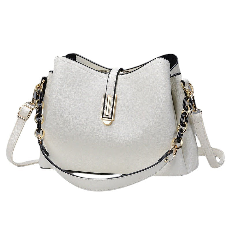 South Steeze off-white shell crossbody bag with a structured PU leather design and decorative chain strap detail