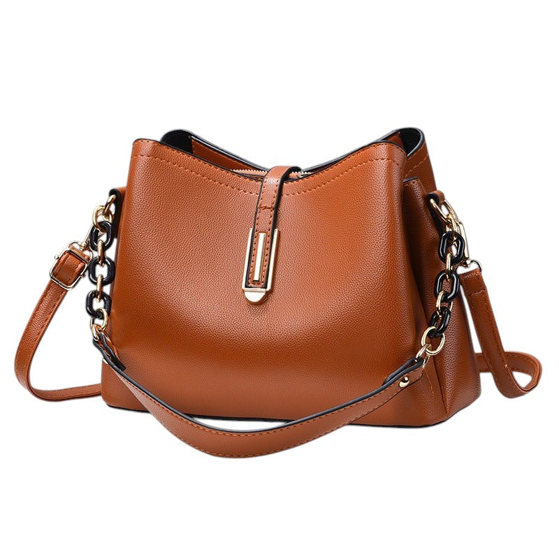 South Steeze tan PU leather shell crossbody bag with adjustable strap and gold-tone hardware detail